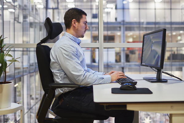 Man sitting at desk, computer, working Indoor air environment photo shoot session Aura